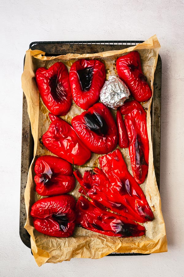 Roasted red peppers in a tray.