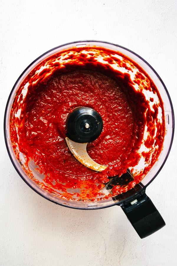 Making harissa paste in a food processor.