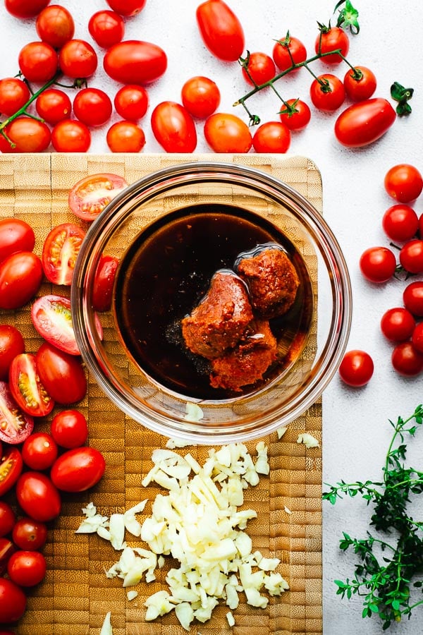 Ingredients for harissa oven-roasted tomatoes.