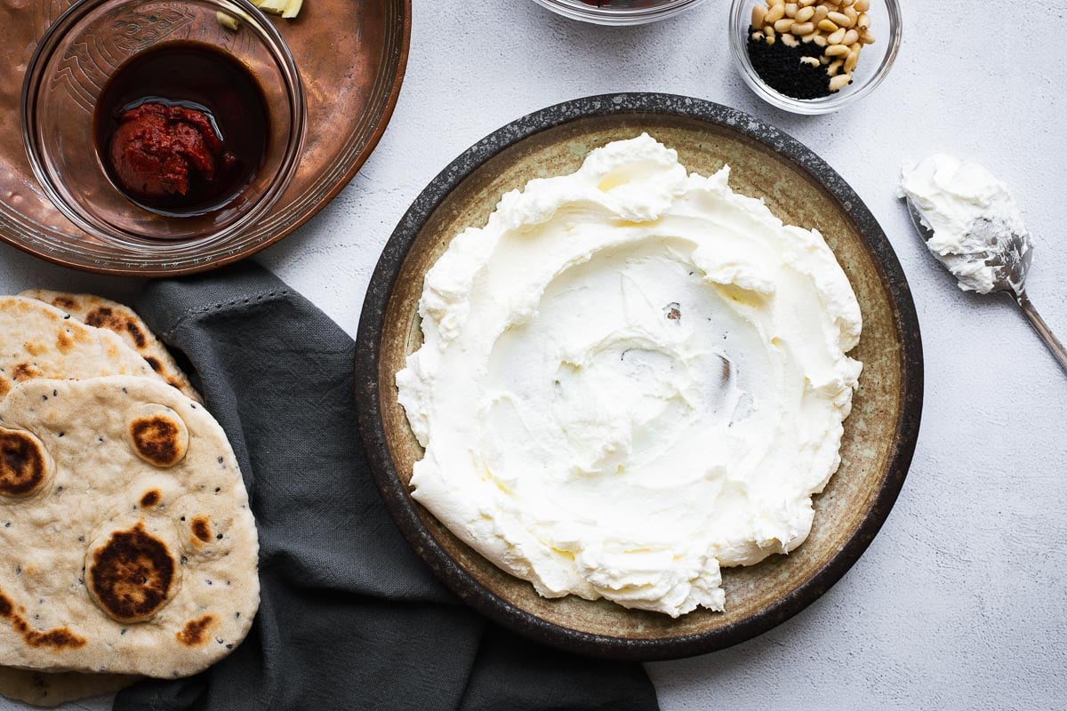 Ingredients for labneh dip with quick harissa tomato sauce.