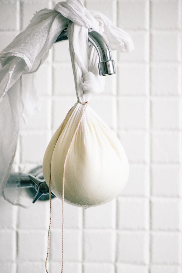 Yoghurt hanging in muslin from an old kitchen tap.