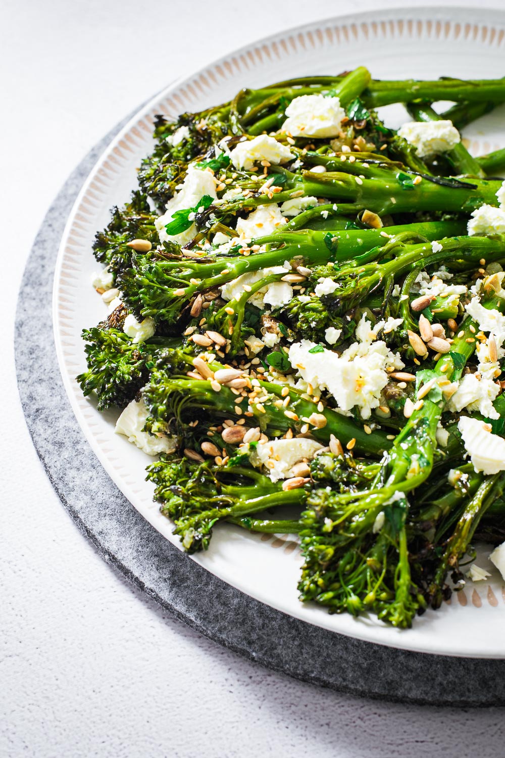 Charred broccolini with preserved lemon, capers and feta.