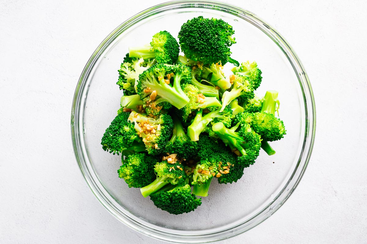 Sesame broccoli salad in a mixing bowl viewed from above.