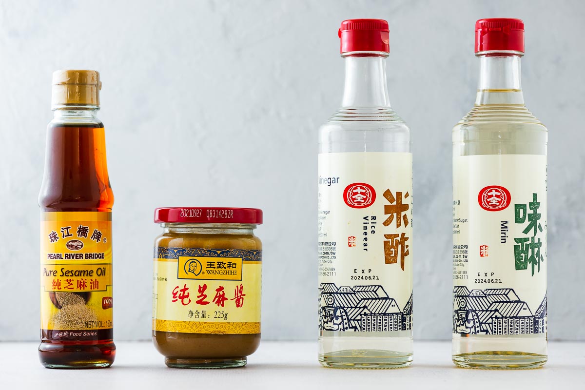 Japanese sesame sauce ingredients including toasted sesame oil, sesame paste, mirin and rice vinegar.