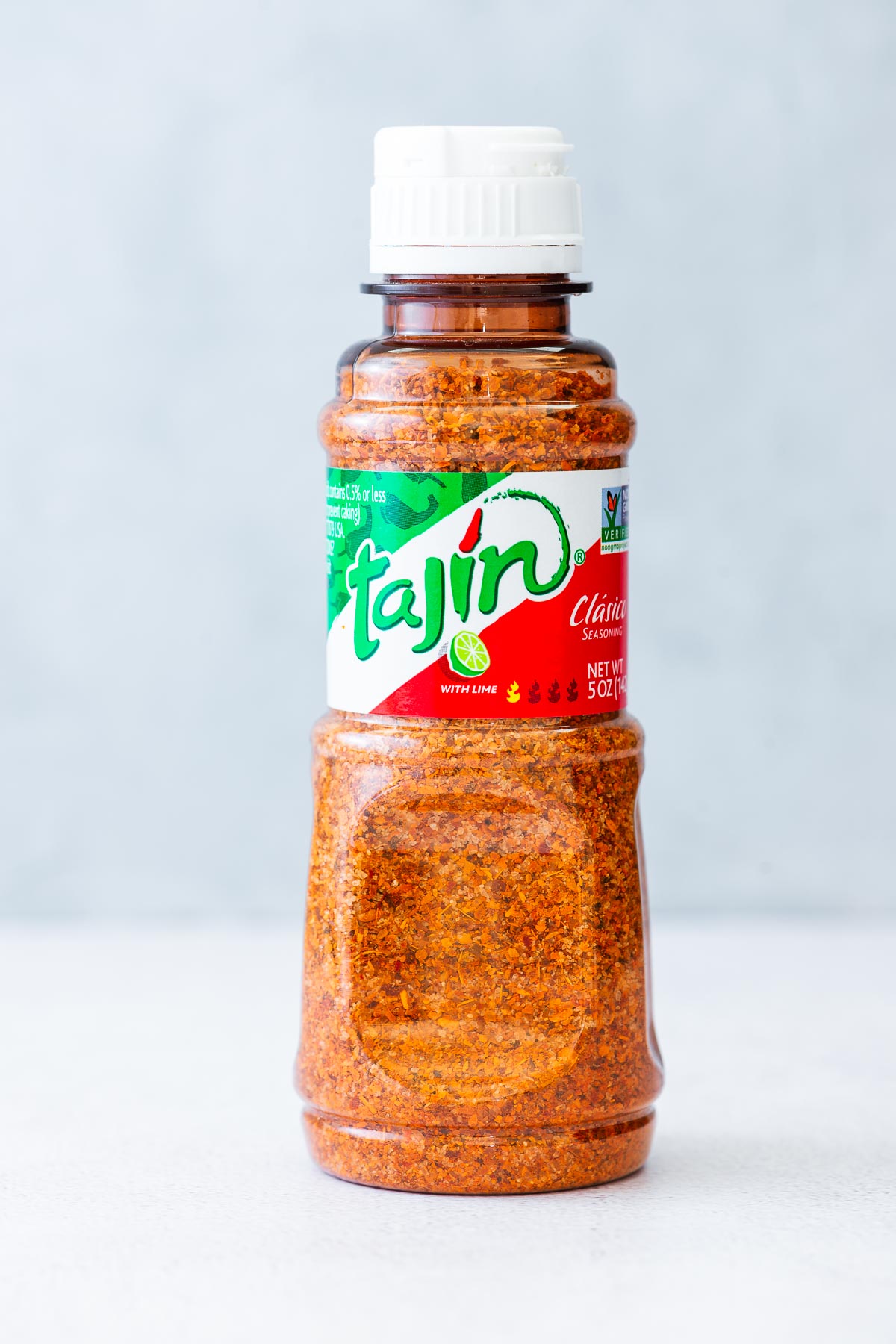 A bottle of Tajín Clásico Seasoning.