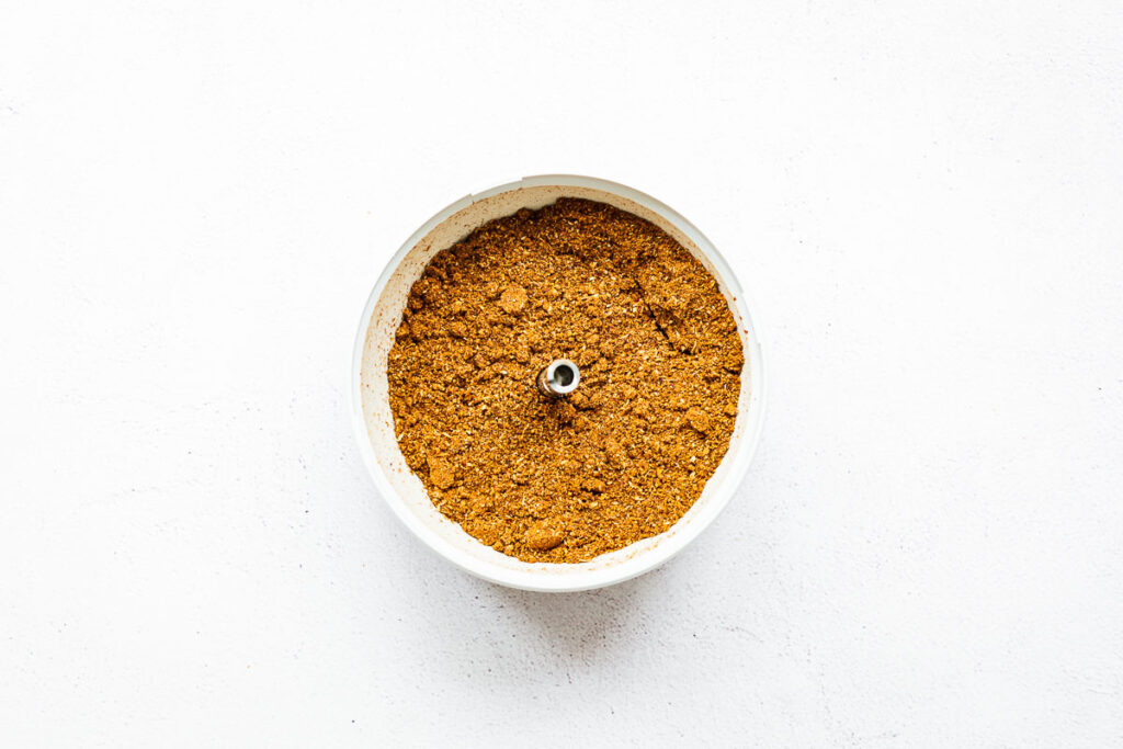 Homemade ground garam masala in a spice grinder.