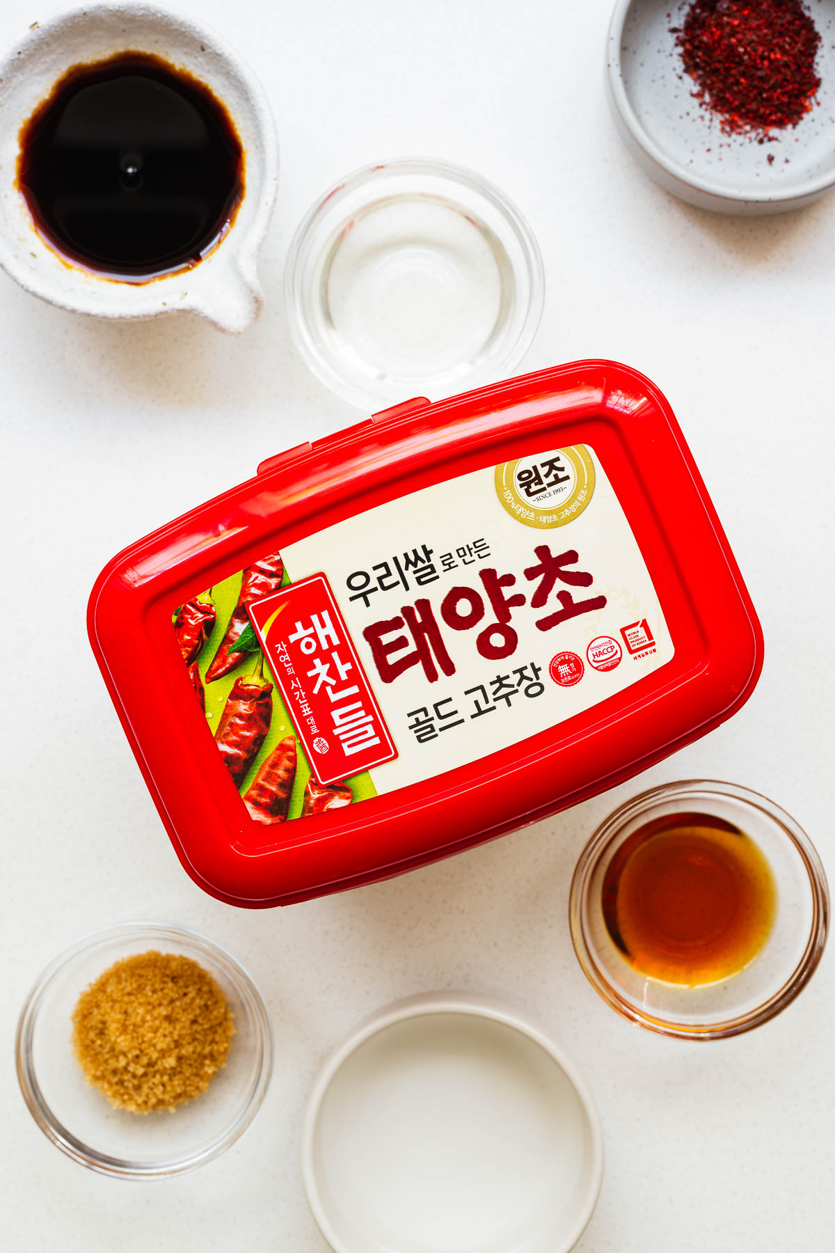 Ingredients for gocuhjang noodle sauce arranged on a kitchen counter.