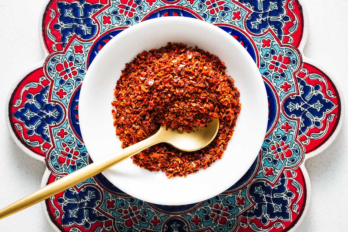 A close-up of the coarse texture of Aleppo pepper flakes.