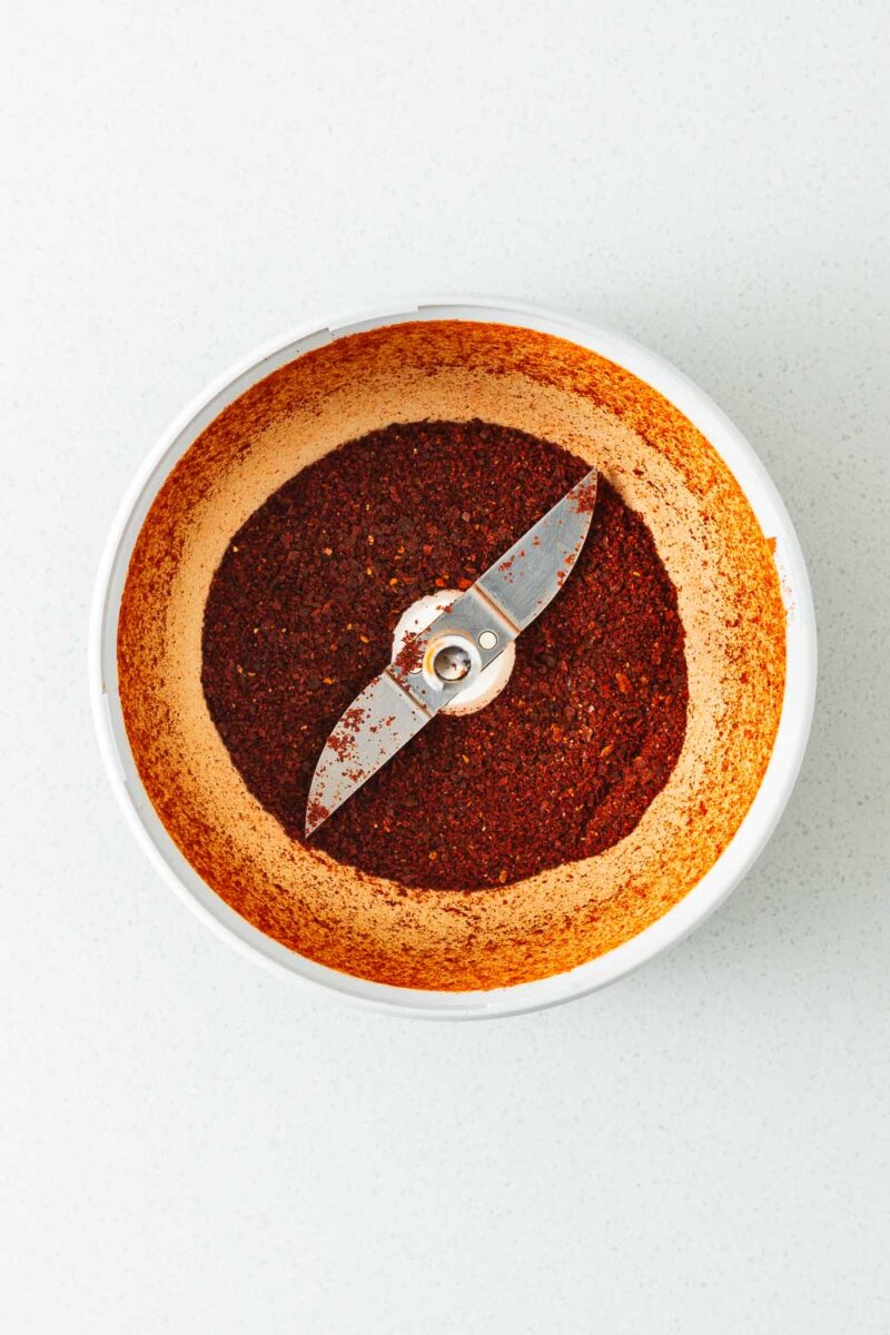Cayenne powder in a spice grinder viewed from above.