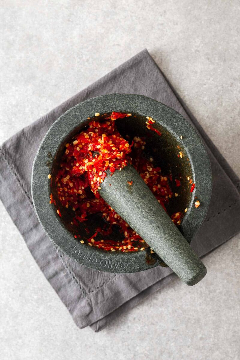 Homemade sambal oelek paste in a mortar and pestle.