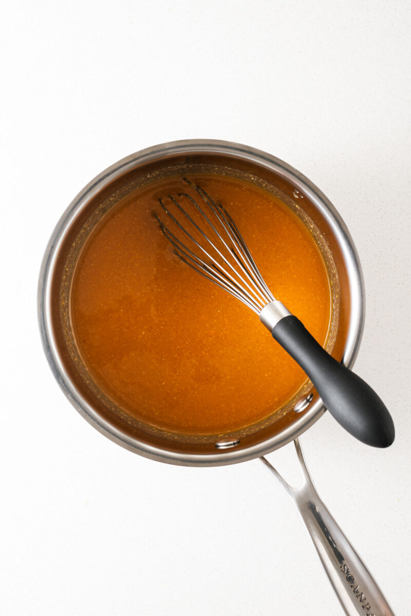 Smooth miso ingredients whisked together in a saucepan.