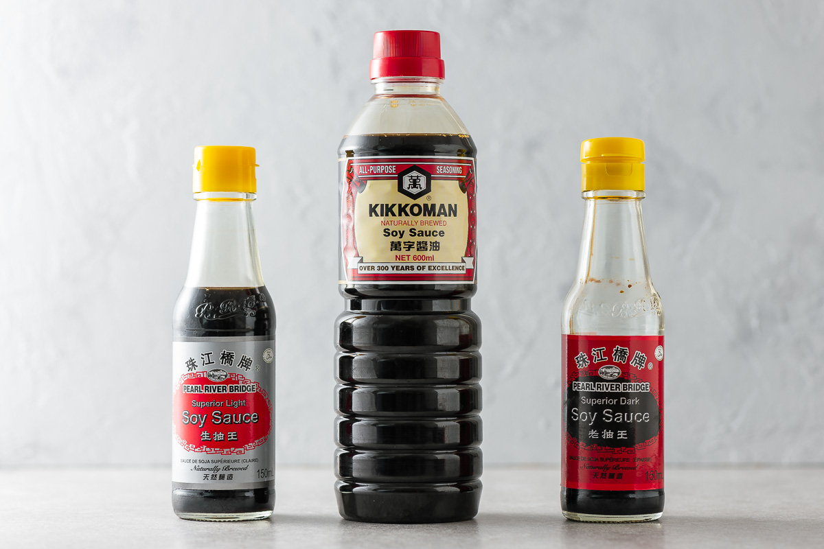 Three bottles of soy sauce: all-purpose, light and dark soy sauce.
