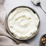 Homemade labneh cheese in a shallow bowl viewed from above.