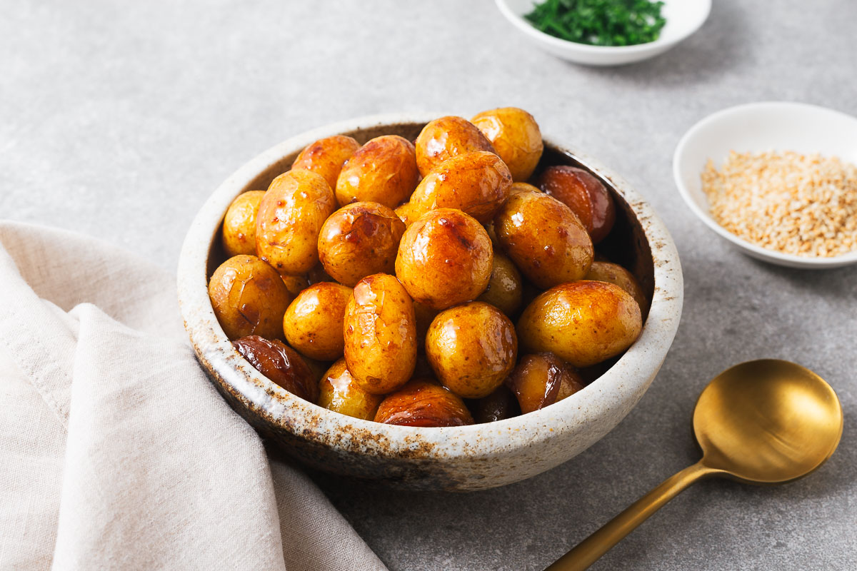 Korean soy-braised baby potatoes in a serving bowl.