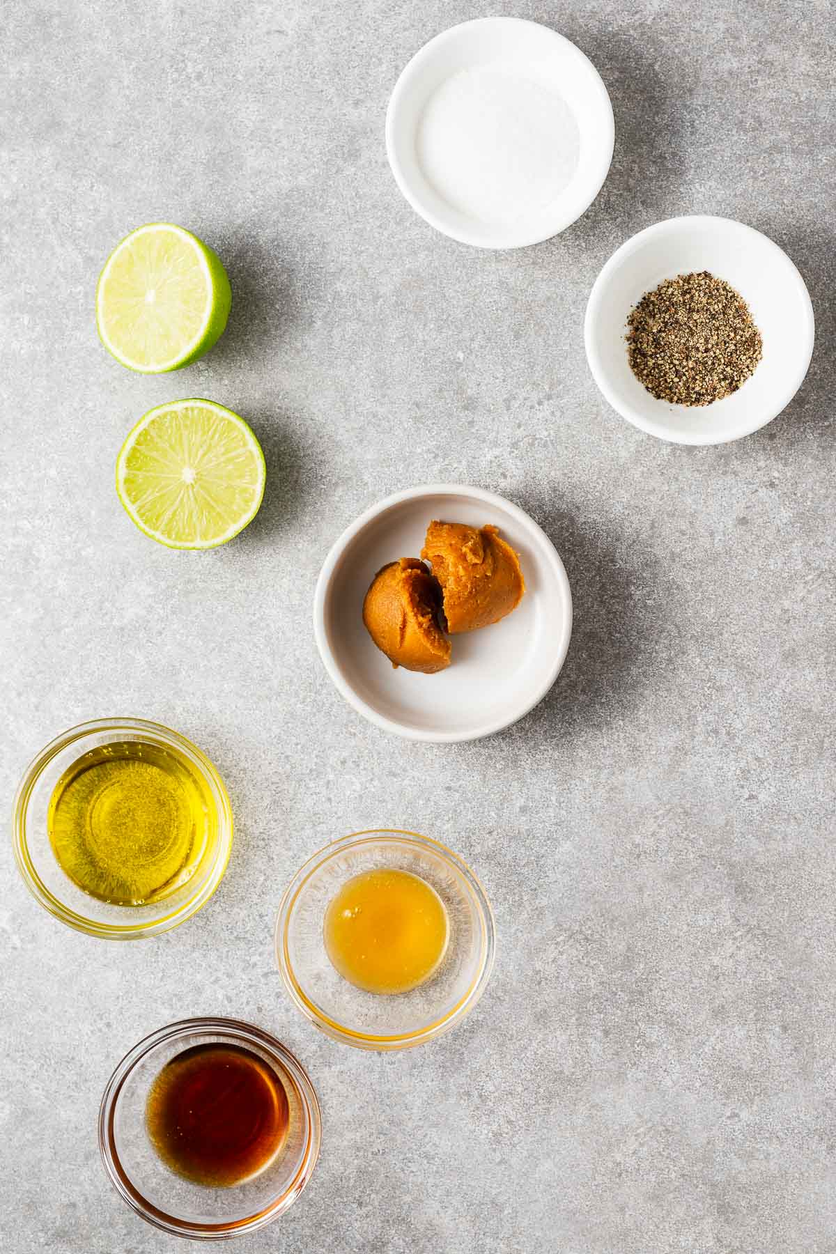 The ingredients for miso lime dressing include olive oil, sesame oil, miso paste, lime juice, honey and salt and pepper.