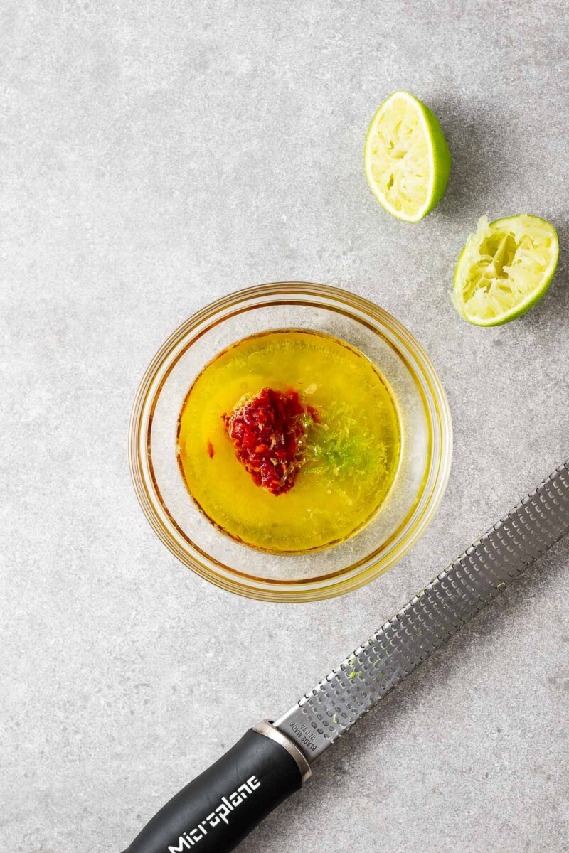 A Microplane used to grate the zest from fresh limes into the spicy lime vinaigrette.