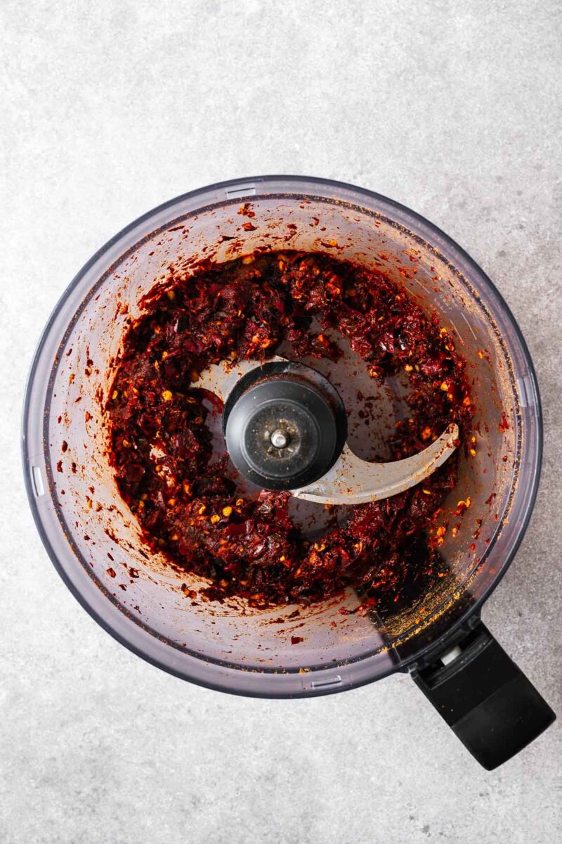 A coarse chilli paste consisting of the rehydrated chiles and dry harissa paste ingredients.