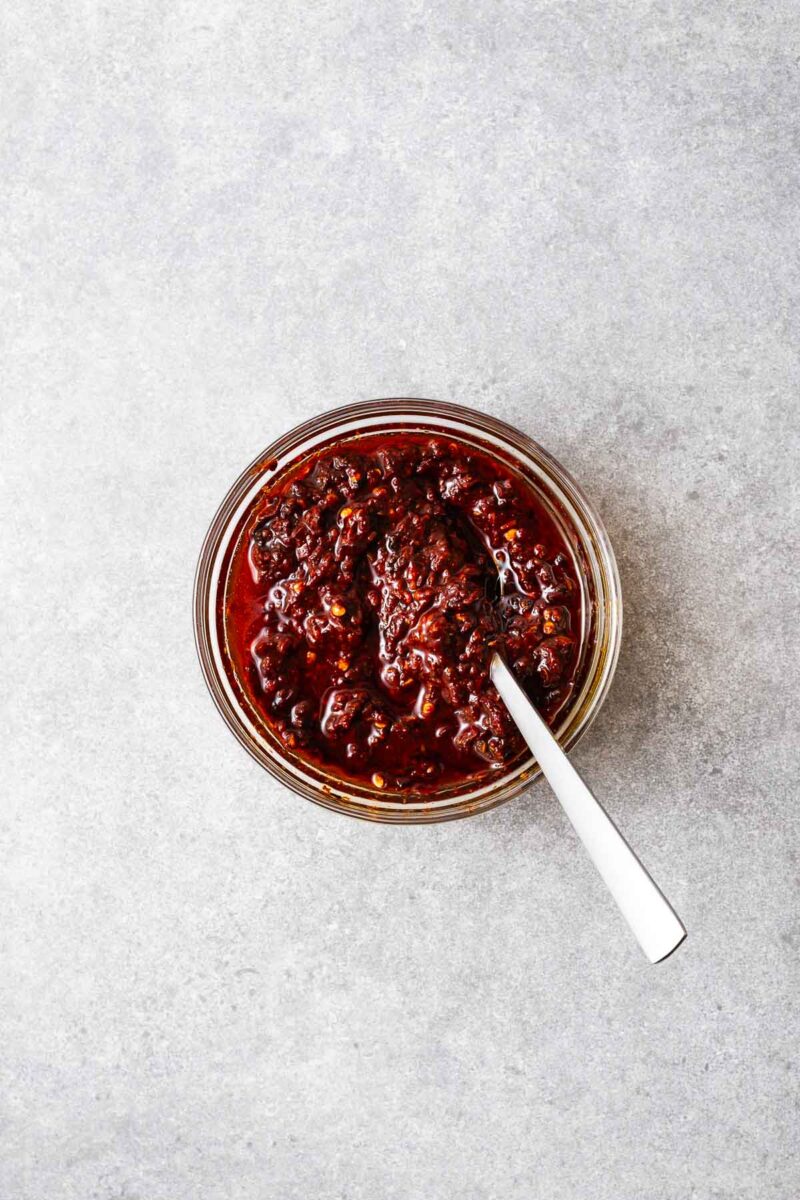 Homemade harissa paste with a luscious texture after stirring in the olive oil.