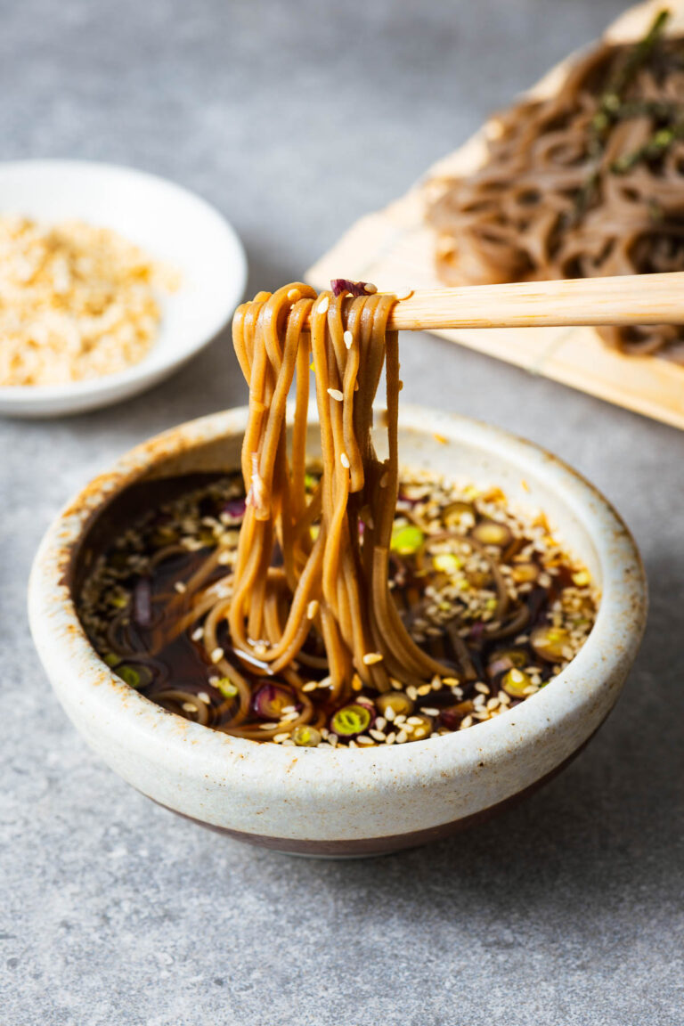 Cold soba noodles dipped into Japanese noodle dipping sauce.