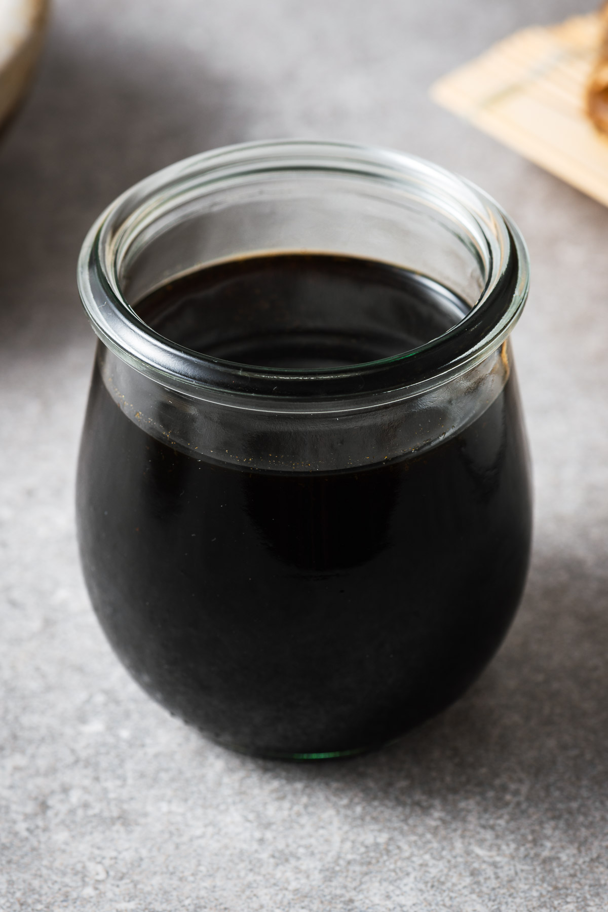 A glass jar with mentsuyu (Japanese soup broth concentrate).