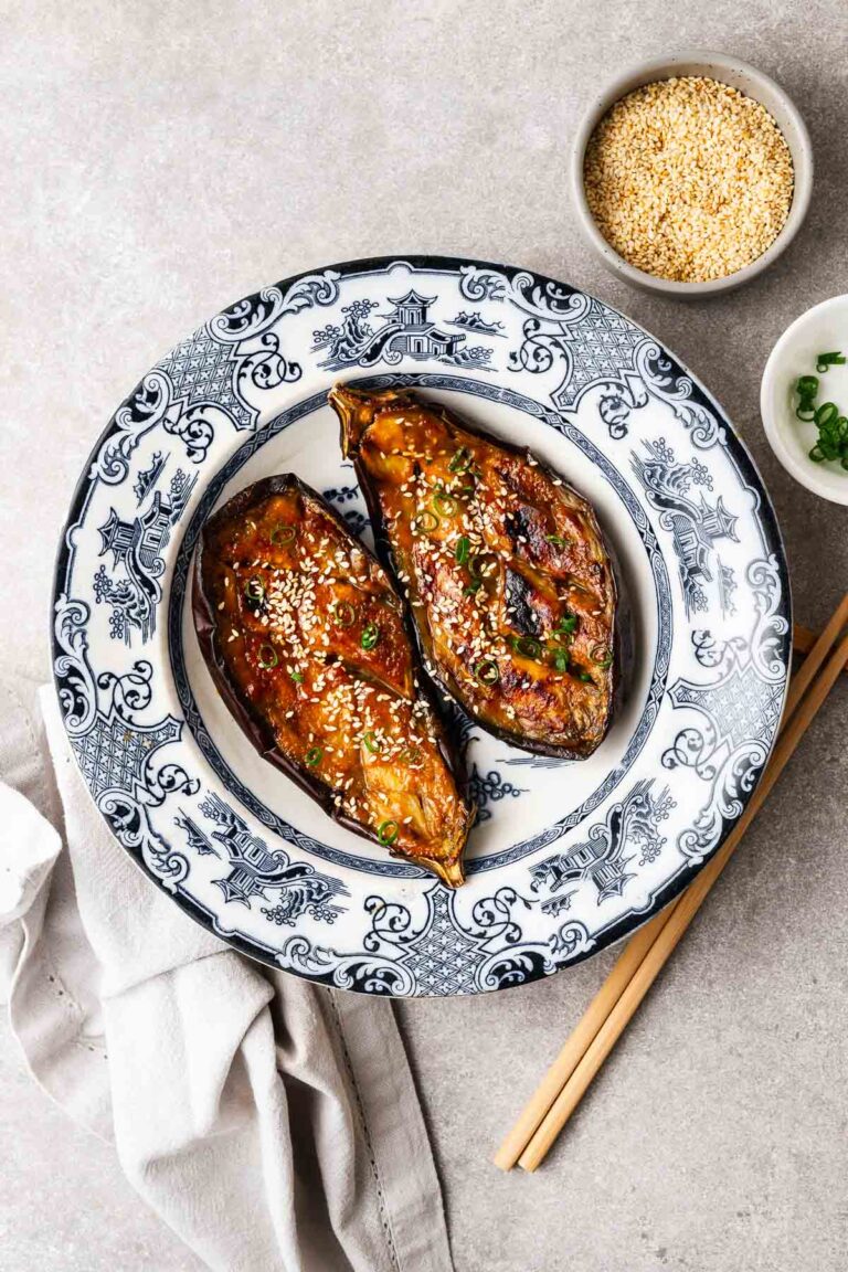 Nasu dengaku (eggplant sliced in half and grilled with miso sauce) in a traditional Japanese ceramic bowl.
