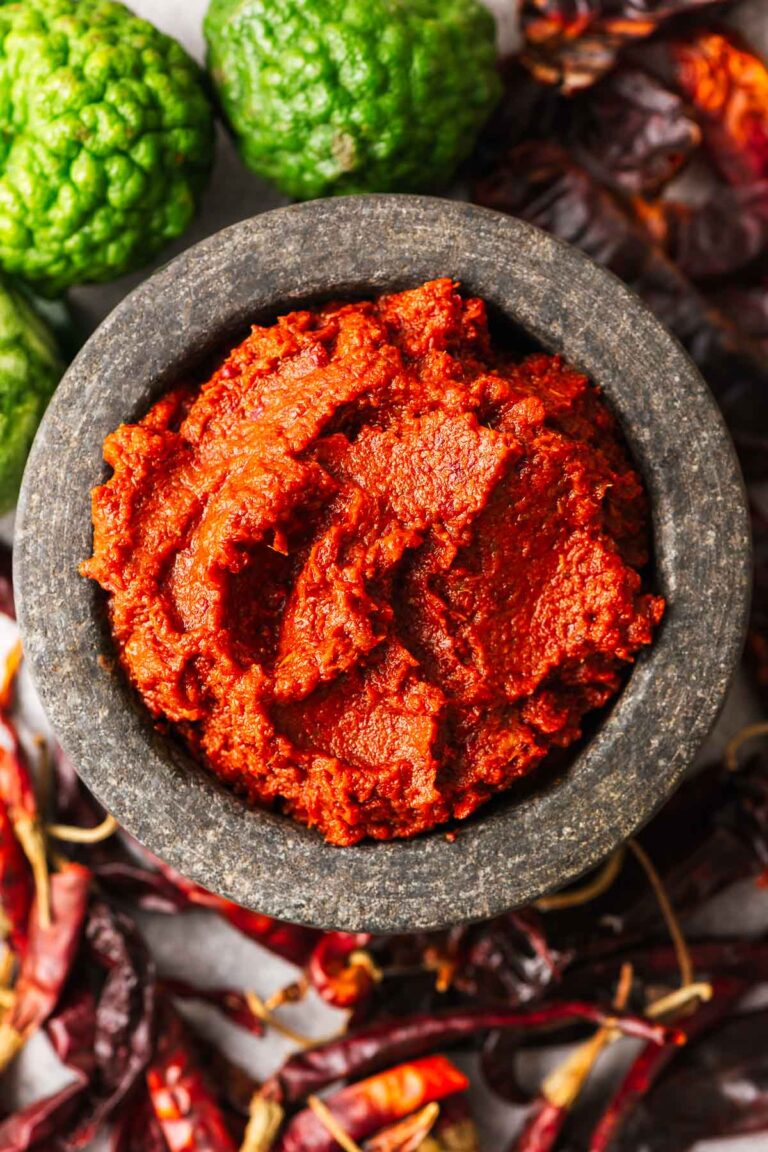 Authentic Thai red curry paste in a stone bowl.