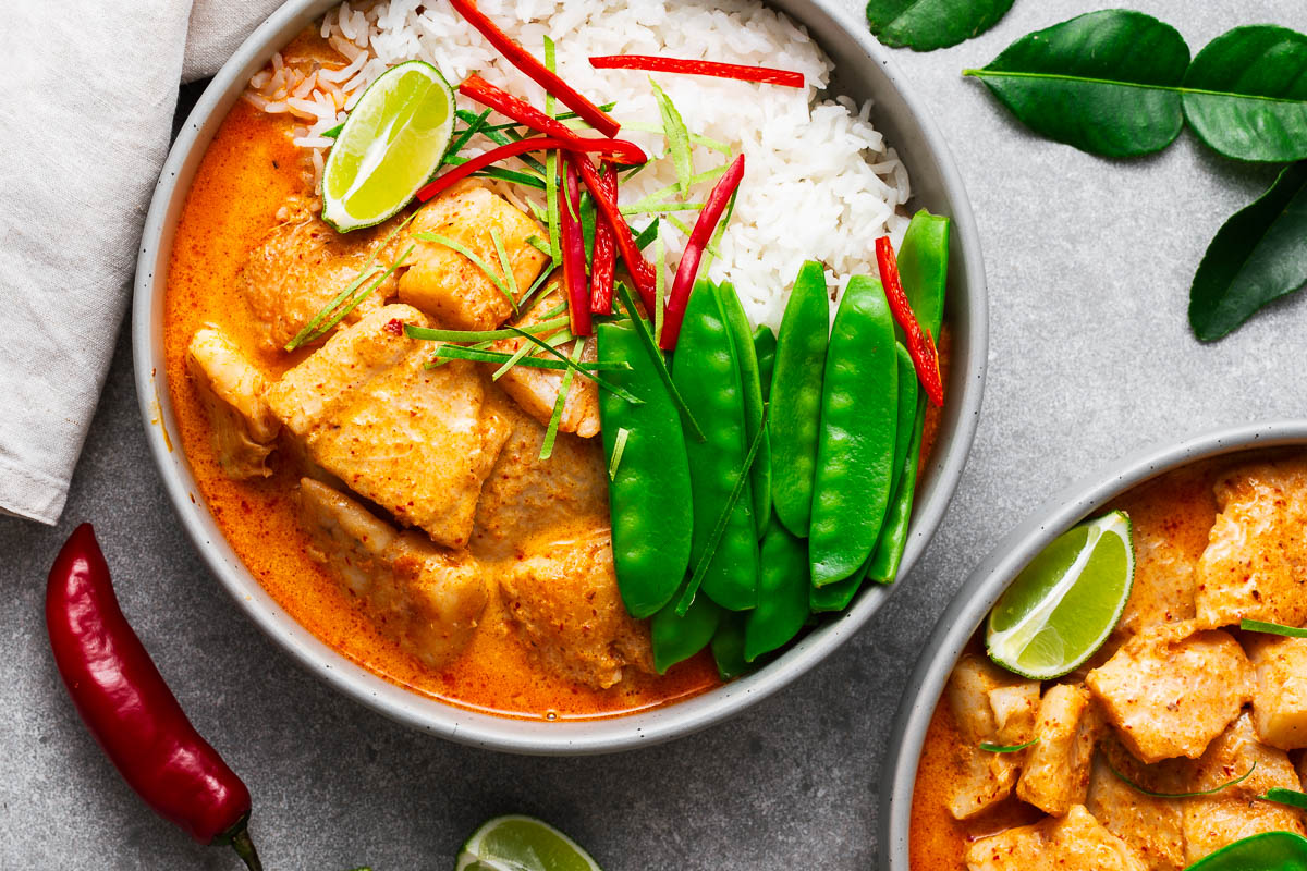 White fish cooked in a Thai red curry sauce with coconut milk served on steamed white rice.